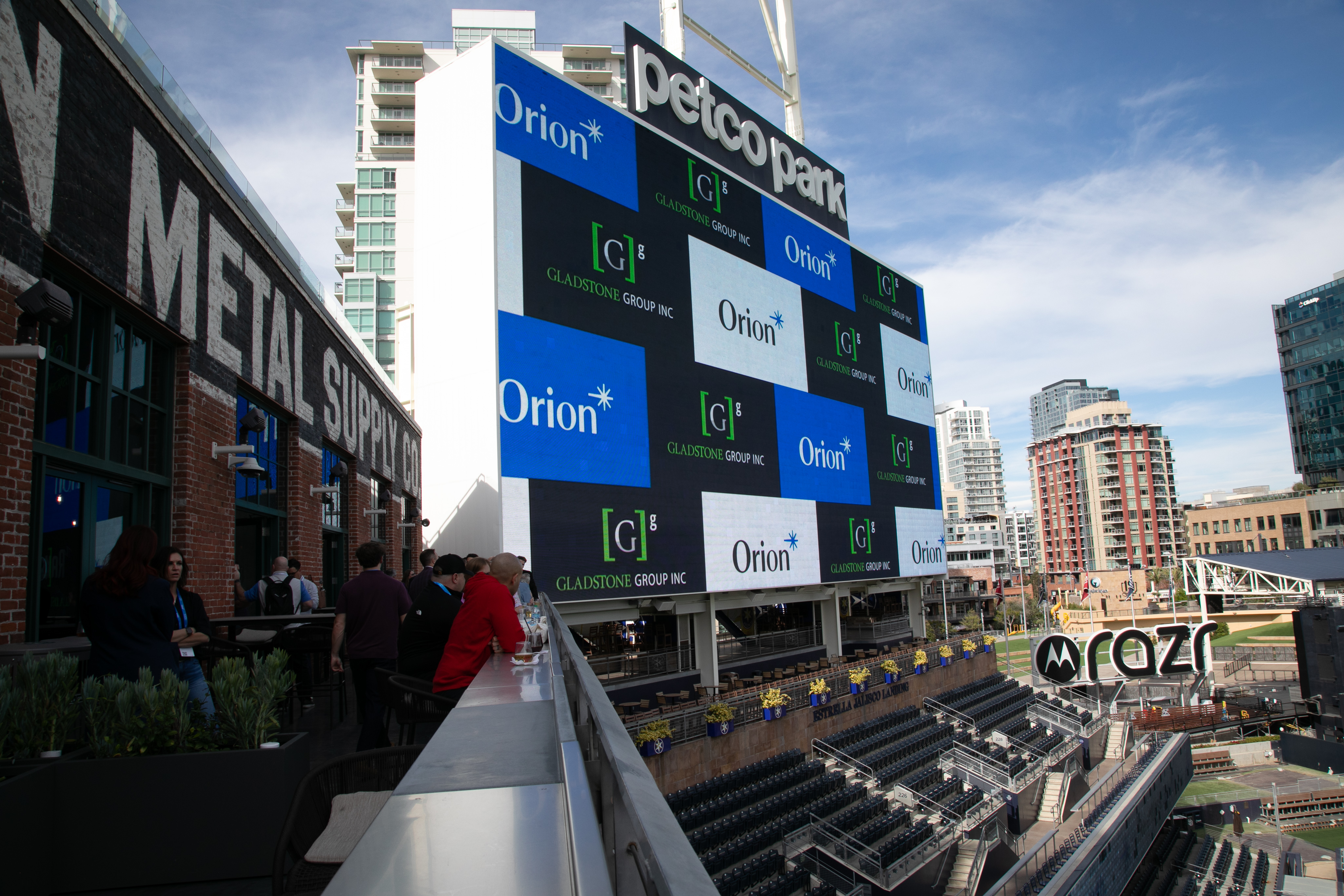 Sponsor logos on the stadium scoreboard at the Ascent 2026 offsite event