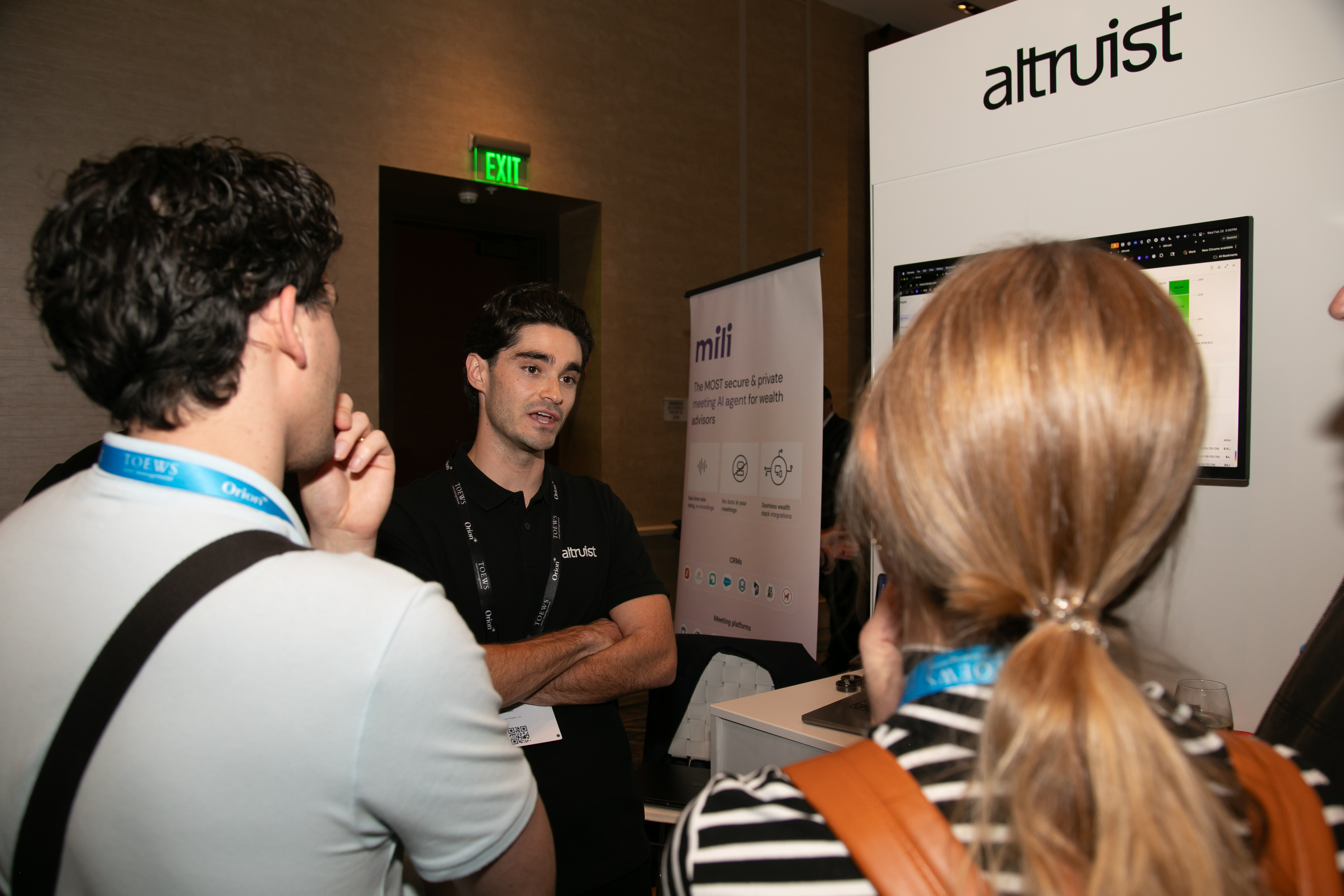 Advisors meeting a sponsor team at their booth