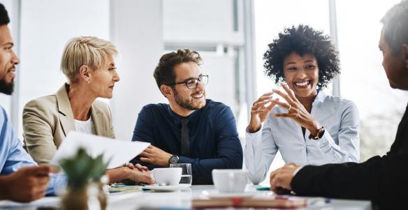 Shot of a group of businesspeople sitting together in a meeting.