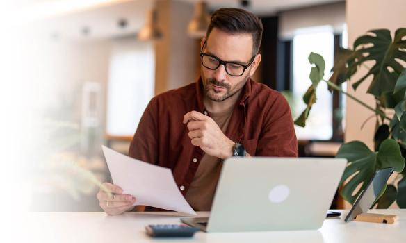 Compliance Professional with laptop reviewing test results