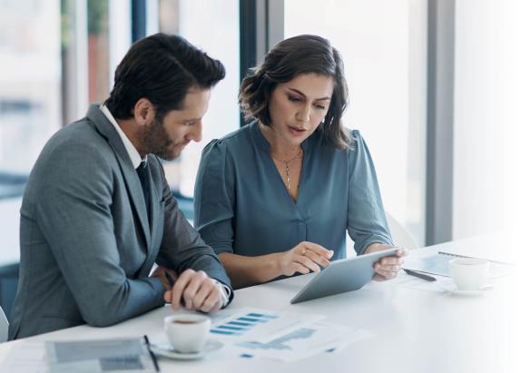 Two professionals finding compliance gaps