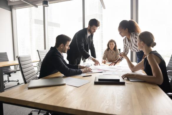 Team discussing work around conference table