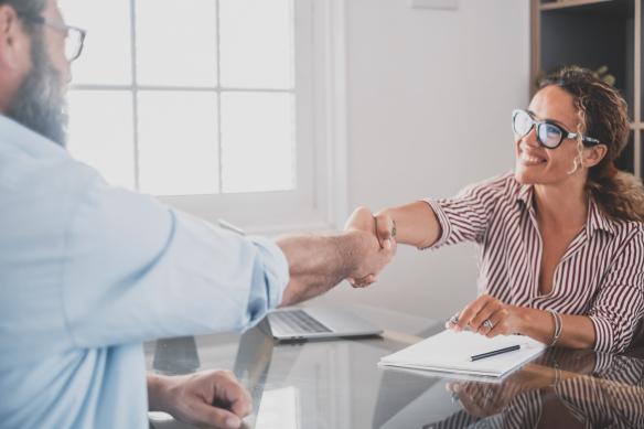 Shaking hands and smiling