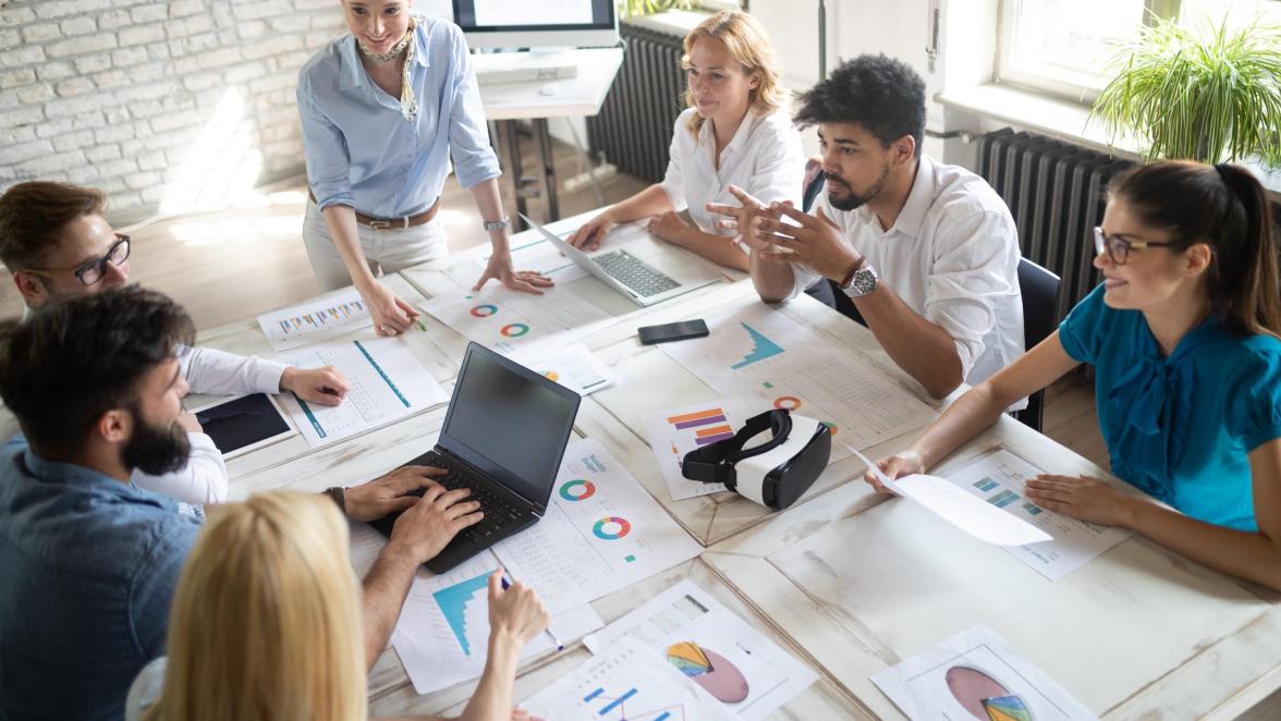 Business, technology and people concept - creative team or designers working on user interface at office