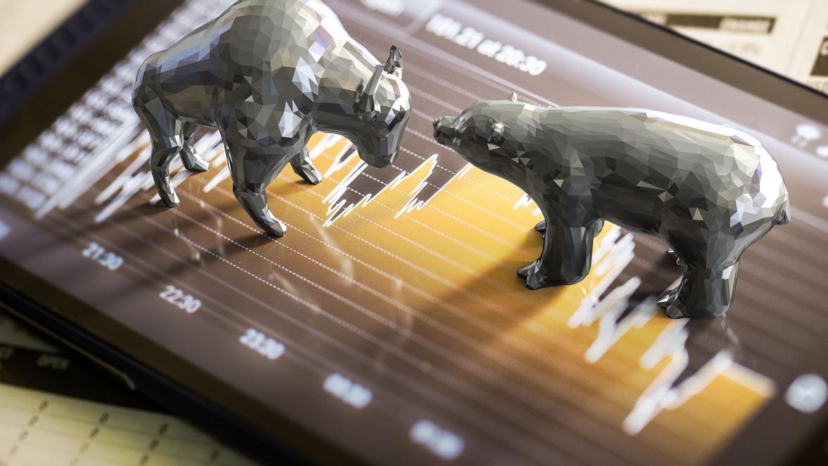Bull and bear economy concept with 3d rendering bull and bear on stock market chart background