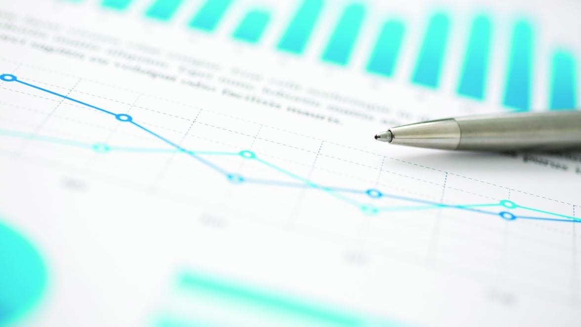 Financial statistics documents ball pen infographics at office table closeup. Internal Revenue Service inspector sum check, investigation, exchange market, earnings, savings, loan and credit concept