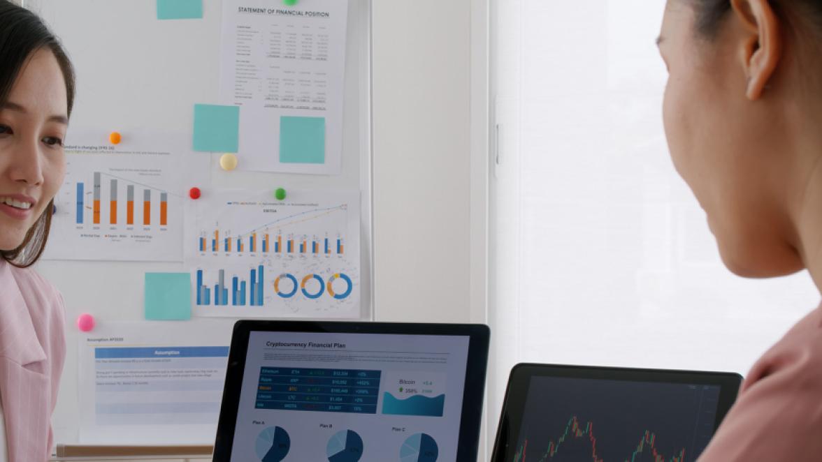 Group asia woman people talk in budget plan report, brief idea on chart graph data in paper work on laptop tablet at office desk table teach in tax loan consult career class, stock broker, trader job.