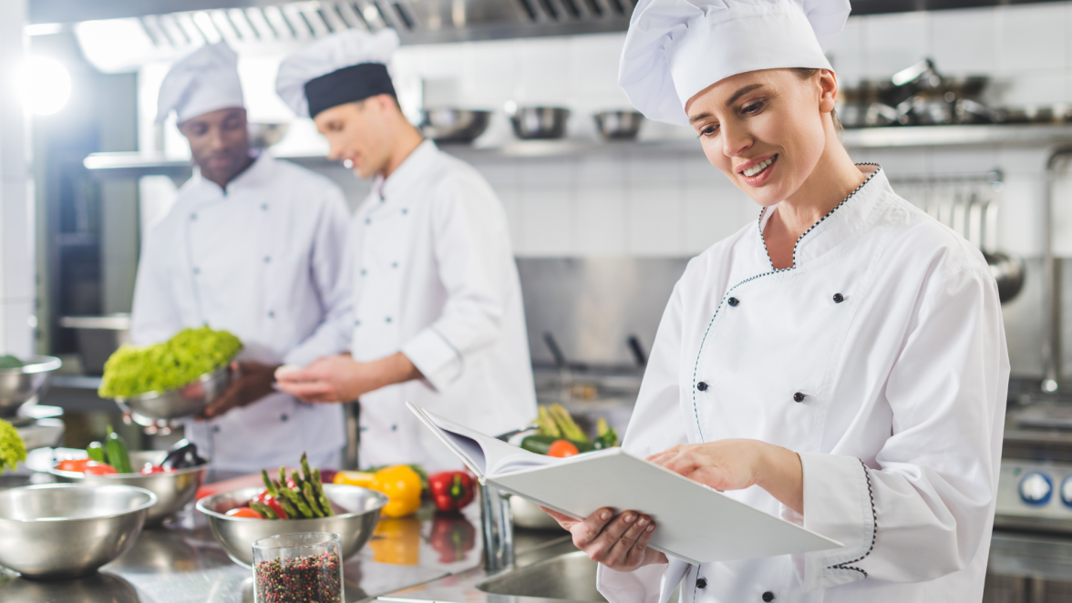 Smiling chefs in kitchen