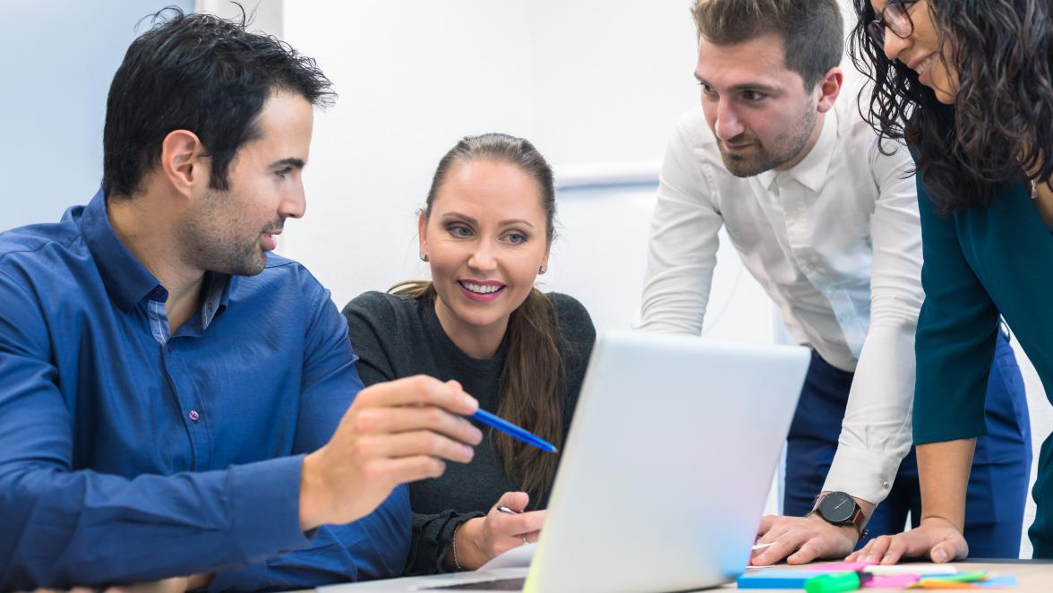 Orion Advisors Discussing AI Around Laptop