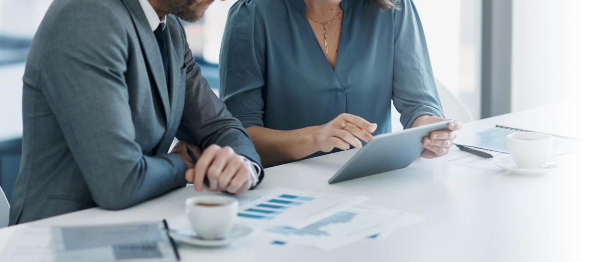 Two professionals finding compliance gaps