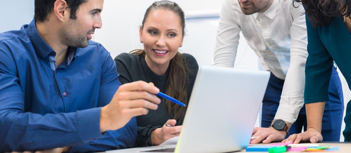 Orion Advisors Discussing AI Around Laptop