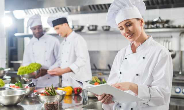 Smiling chefs in kitchen