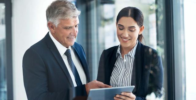 Advisors reading a tablet