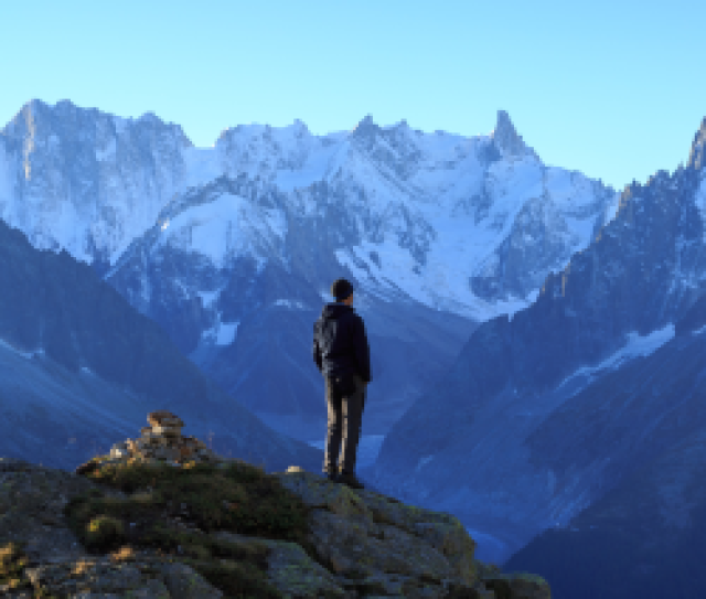 Man looking at mountains