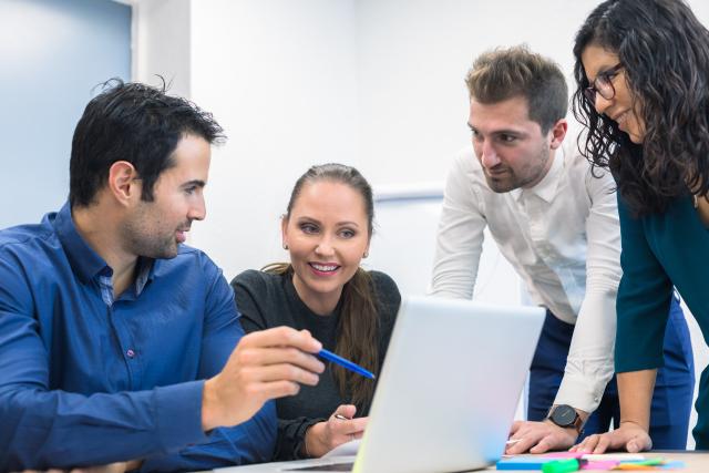 Orion Advisors Discussing AI Around Laptop