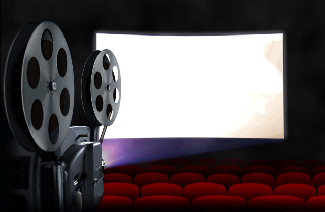 blank-cinema-screen-with-empty-seats-and-projector