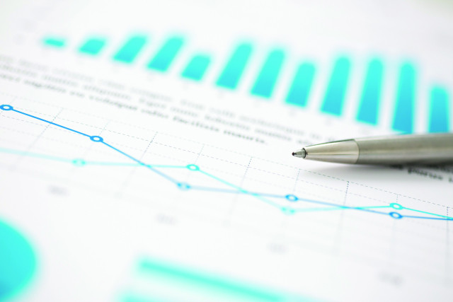 Financial statistics documents ball pen infographics at office table closeup. Internal Revenue Service inspector sum check, investigation, exchange market, earnings, savings, loan and credit concept