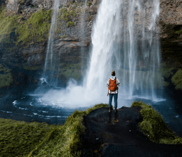 man at waterfall