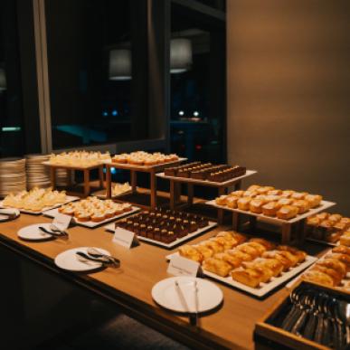 Elaborate dessert buffet setup at an upscale bar