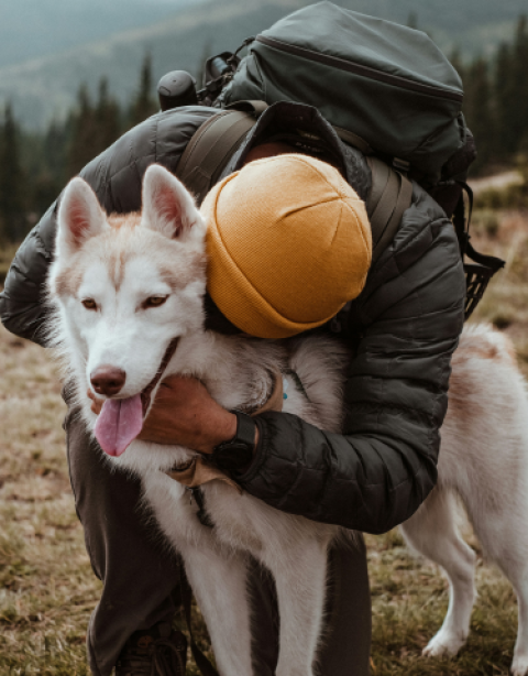 Man hugging dog